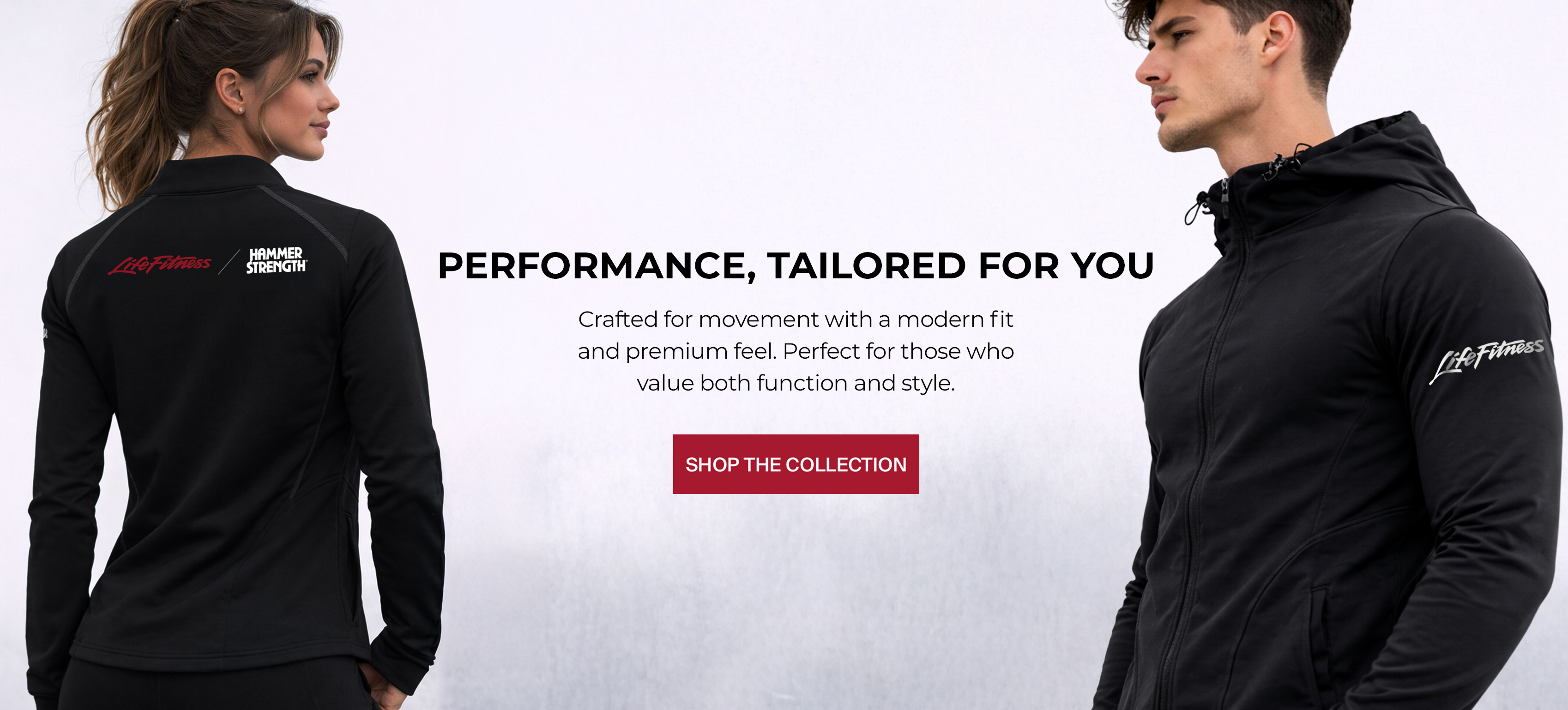 Two models, one woman and one man, wearing co-branded Life Fitness / Hammer Strength merchandise. Text reads: 