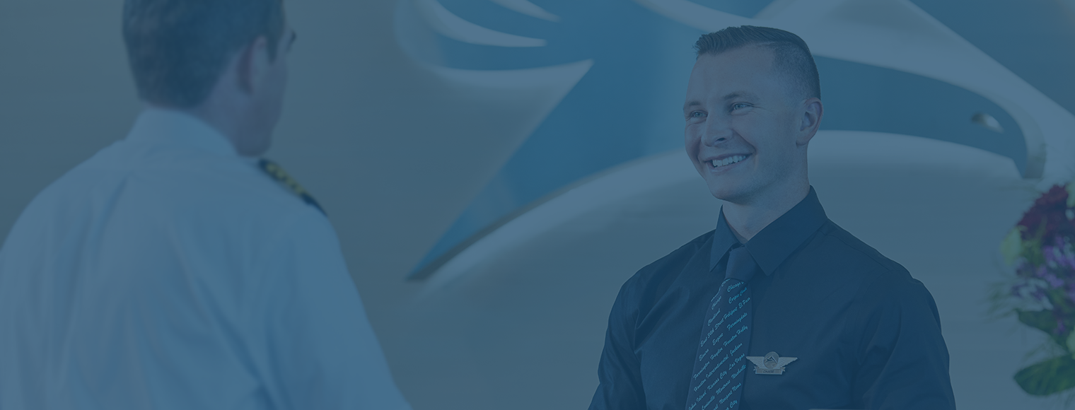 Man and woman walking in an office.